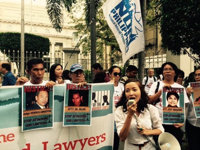 Members of the National Union of Peoples' Lawyers and their clients troop in front of the Supreme Court to call against attacks on lawyers.